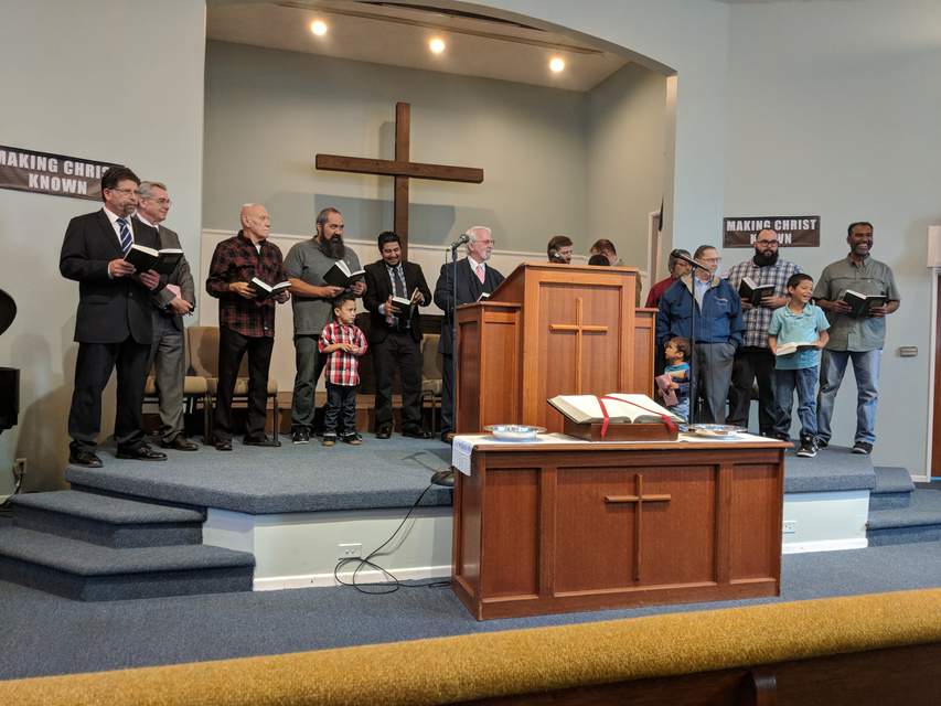 Men of the church singing together on Mother's Day in 2018